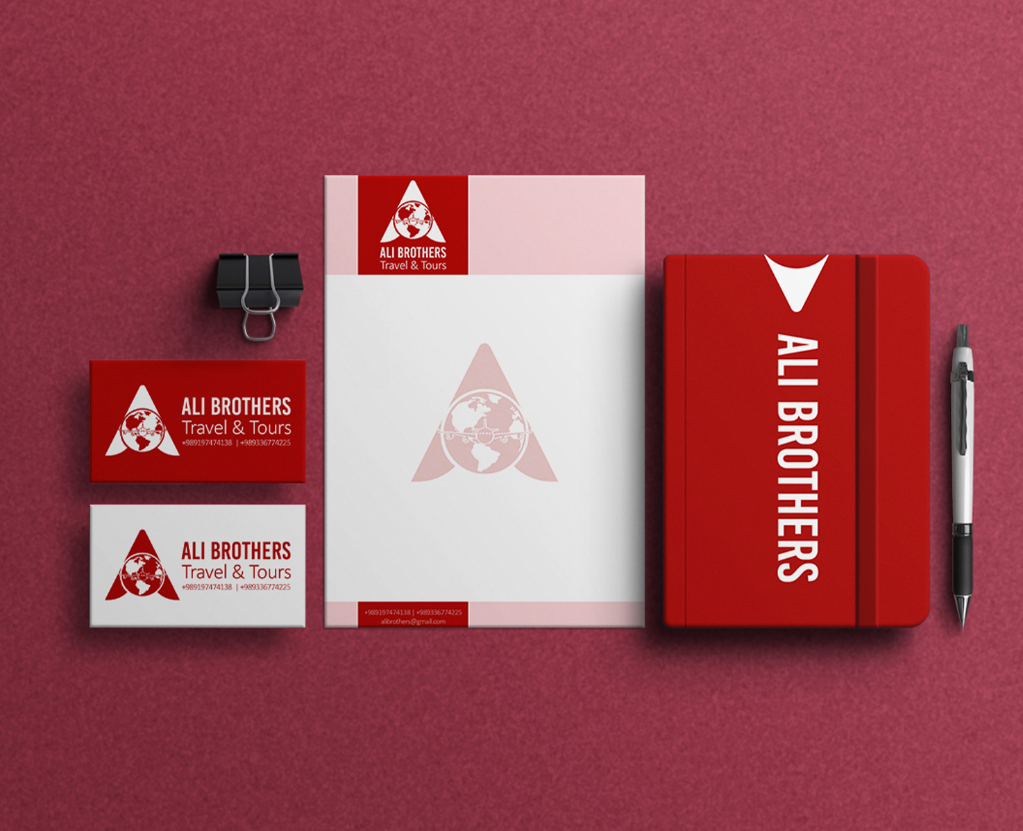 Ali Brothers stationery mockup with red and white business cards, letterhead, notebook and pen.