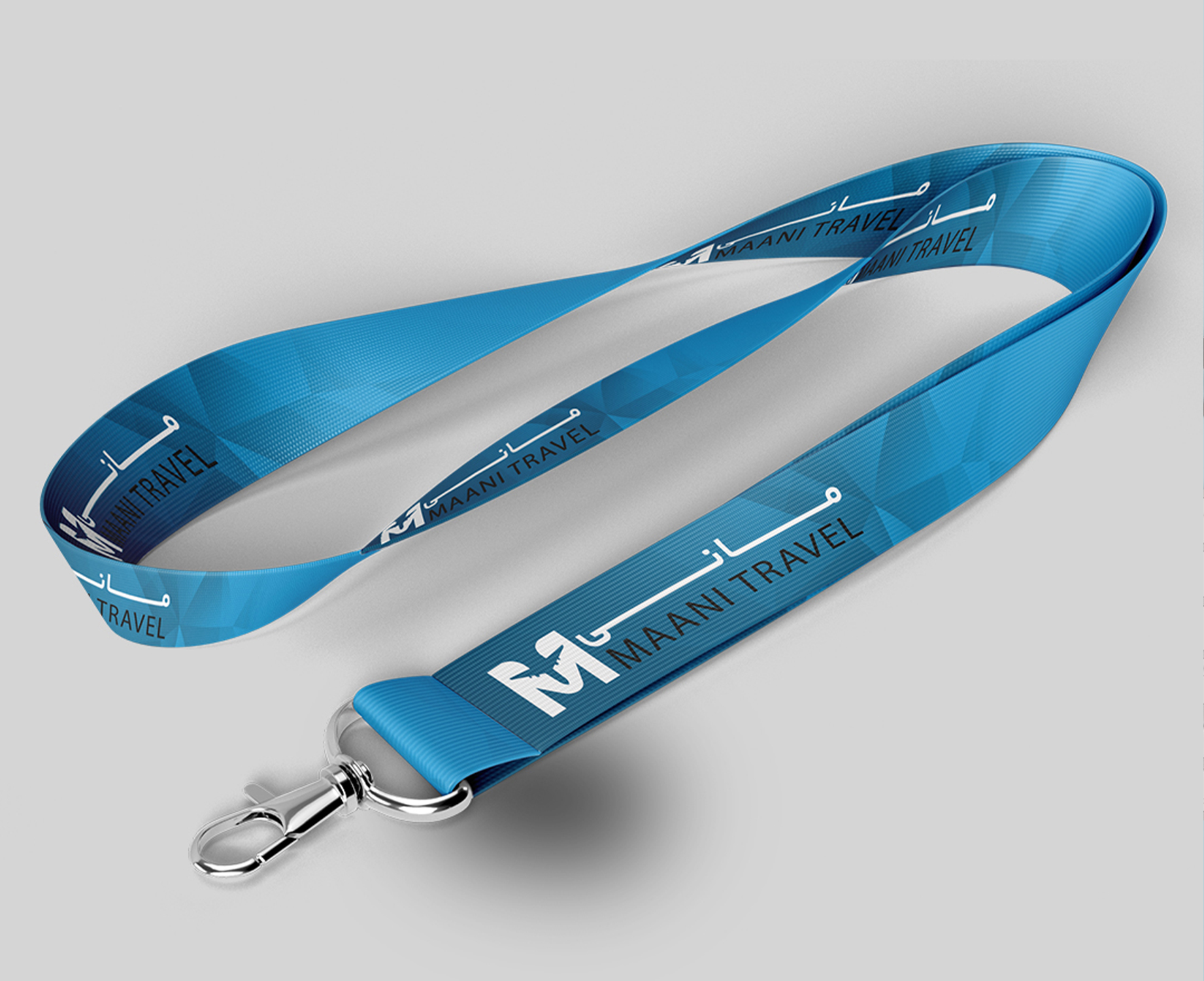 Sky-blue Maani Travel branded lanyard with a metal clip and repeated white logo and wordmark.